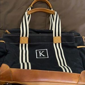 Pottotery barn baby diaper with an K  initial